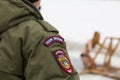 Russian police - emblem on the back OMON during winter cloudy day