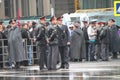 The Russian police during a rain, near procession of communists