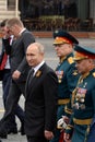 Russian President Vladimir Putin with defense Minister Sergei Shoigu and army General Oleg Salyukov during the celebration of the