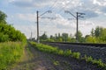 russian railway. Green forest with blue sky and clouds. Royalty Free Stock Photo