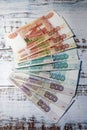 Russian roubles banknotes on wooden table background Royalty Free Stock Photo