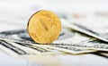 Russian roubles coins on dollars and Royalty Free Stock Photo
