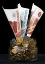 Russian roubles in a glass can Royalty Free Stock Photo