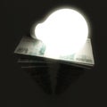 Russian roubles stack with shiny lightbulb Royalty Free Stock Photo