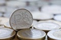 Russian ruble against the backdrop of coins of various countries Royalty Free Stock Photo