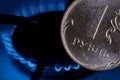 Russian ruble coin on the background of a gas burner