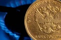 Russian ruble coin on the background of a gas burner