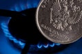 Russian ruble coin on the background of a gas burner