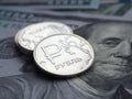 Russian ruble on dollars background