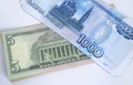Russian rubles and American dollars on a white background