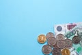 Russian rubles on a blue background. Thousand notes and various coins. Place for text