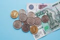 Russian rubles on a blue background. Thousand notes and various coins