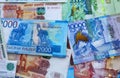 Russian rubles and Kazakhstan national currency, top view of mixed tenge and roubles banknotes Royalty Free Stock Photo