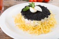 Russian salad with black caviar Royalty Free Stock Photo