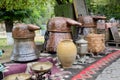 Russian samovar and old copper tanks for making grape vodka