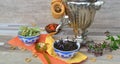 Traditional russian samovar on shabby table, a symbol of hospitality. Crispy bagels, drying or bagels and herbal linden and mint