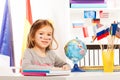 Russian schoolgirl sitting at a desk in classroom Royalty Free Stock Photo