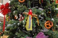 Russian Shrovetide doll in traditional colorful dress hanging on Christmas tree at Russian national festival `Shrove` in Moscow