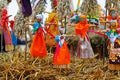 Russian Shrovetide small dolls in traditional colorful dresses on the occasion of the arrival of spring