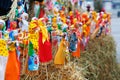 Russian Shrovetide small dolls in traditional colorful dresses on the occasion of the arrival of spring