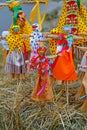 Russian Shrovetide small dolls in traditional colorful dresses on the occasion of the arrival of spring in the Park Gorkogo