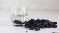 Russian shungite stones on a white background used in alternative medicine for water purification and recharge due to