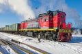 Russian shunting diesel locomotive TEM18DM with freight train