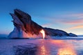Russian Siberian fiery landscape. Sunrise at Lake Baikal. Fire and ice on the background of a rock.