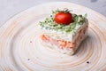 Russian smoked salmon salad on a plate