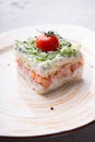 Russian smoked salmon salad on a plate