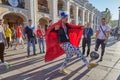 Russian soccer fan with foolish hat kicks ball, St Petersburg.