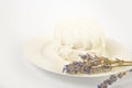 Russian soft dessert zefyr souffle served on plate with dried lavender flowers on white background Royalty Free Stock Photo