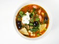 Russian Solyanka soup in a white deep plate. View from above Royalty Free Stock Photo