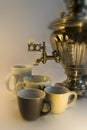 Russian Teapot with Water Fountain and Cups Royalty Free Stock Photo