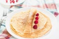 Russian thin pancake with raspberries