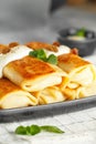 Russian thin pancakes with cottage cheese and raisins. Healthy traditional breakfast Royalty Free Stock Photo