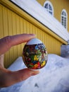 russian tradition, colorful egg in a hand