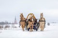 Russian traditional fun - galloping on three horses in winter in a sleigh. Three horses jump together at high speed. Royalty Free Stock Photo