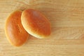 Russian traditional patties with egg and green onion lie on a wooden board. Delicious ruddy baked patties Royalty Free Stock Photo