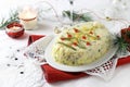 Russian traditional salad Olivier with vegetables, meat. Christmas season. Royalty Free Stock Photo