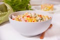 Russian traditional salad Olivier with vegetables and meat in the white bowl Royalty Free Stock Photo