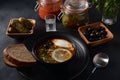 Russian traditional soup `Solyanka` with meat, sausages, salted cucumbers and olives Royalty Free Stock Photo