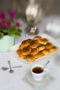 Russian traditional teaparty with samovar and pies or pirozhki with apple jam