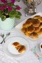 Russian traditional teaparty with samovar and pies or pirozhki with apple jam