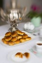 Russian traditional teaparty with samovar and pies or pirozhki with apple jam