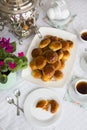 Russian traditional teaparty with samovar and pies or pirozhki with apple jam