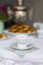 Russian traditional teaparty with samovar and pies or pirozhki with apple jam