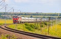 The Russian train travels by rail. Passenger train rides through the fields. Russian railway. locomotive. Russia, Anapa, July 16, Royalty Free Stock Photo