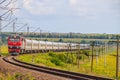 The Russian train travels by rail. Passenger train rides through the fields. Russian railway. locomotive. Russia, Anapa, July 16, Royalty Free Stock Photo