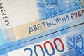 Russian two thousandth notes close-up against the background of a dark wooden table Royalty Free Stock Photo